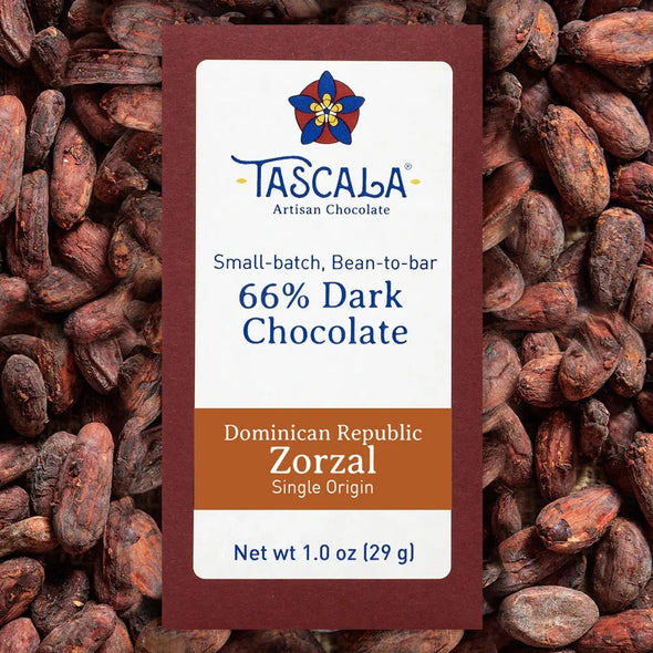 Product photo of a Tascala 66% Dominican Republic Zorzal chocolate bar package with a background of cocoa beans