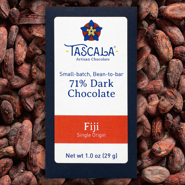 Product photo of Tascala 71% Fiji dark chocolate bar with background of cocoa beans