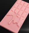 Close up of a Tascala Chocolate Raspberries & Cream bar showing the unique melty bar design