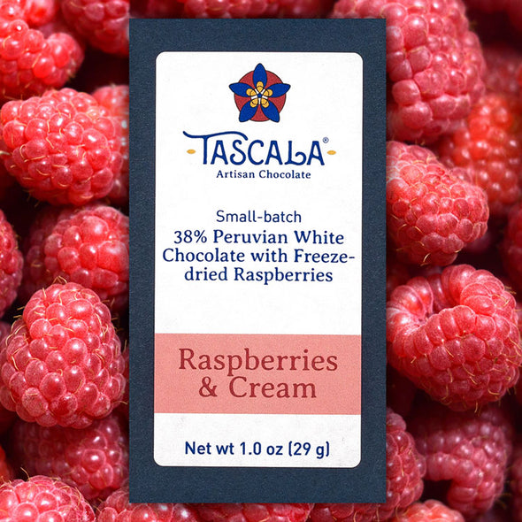 Product photo of a Tascala Raspberries & Cream chocolate bar with a background of big red raspberries
