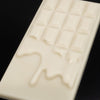 Close up of a Tascala white chocolate bar showing its unique melty design